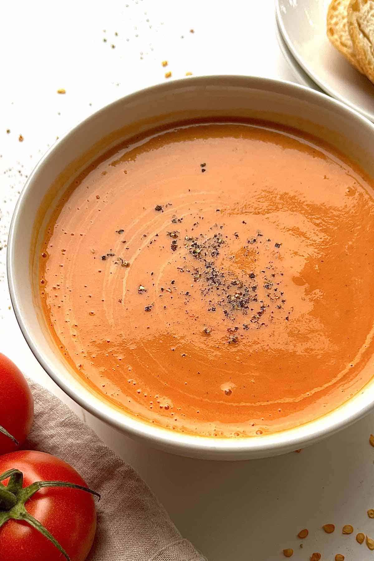 Easy blender tomato soup in a white bowl.