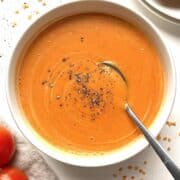 Easy blender tomato soup in a white bowl.