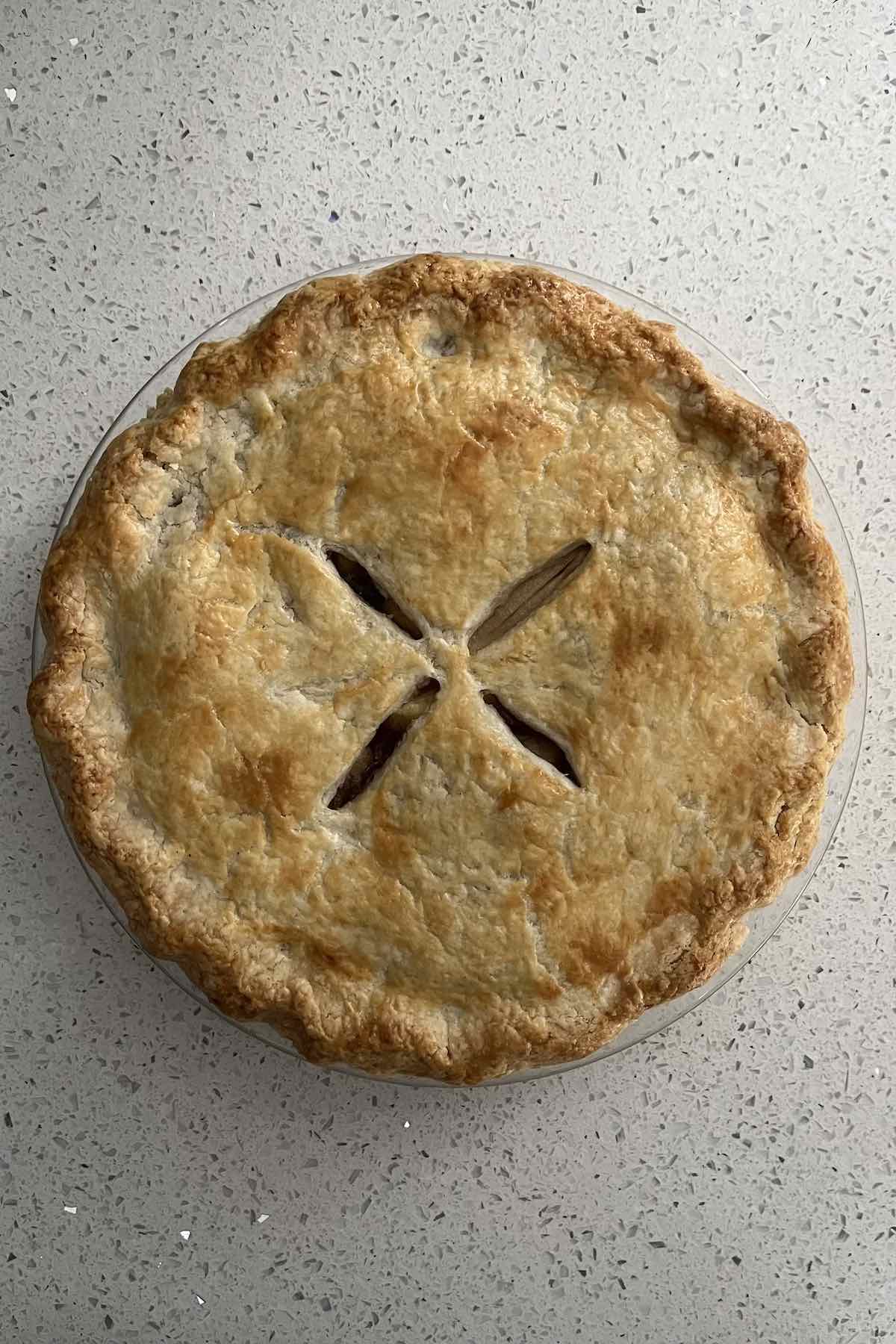Baked apple pie on counter.