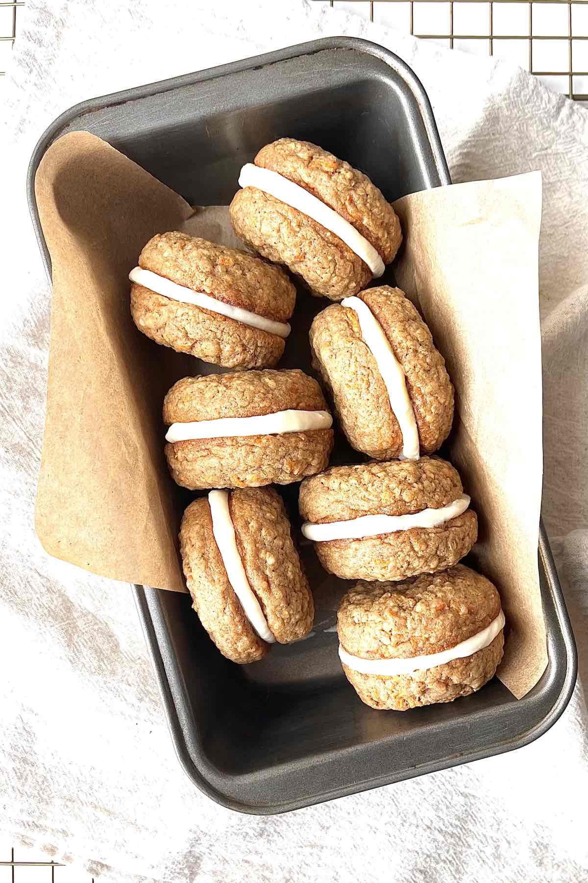 Carrot cake sandwich cookies in a loaf pan.