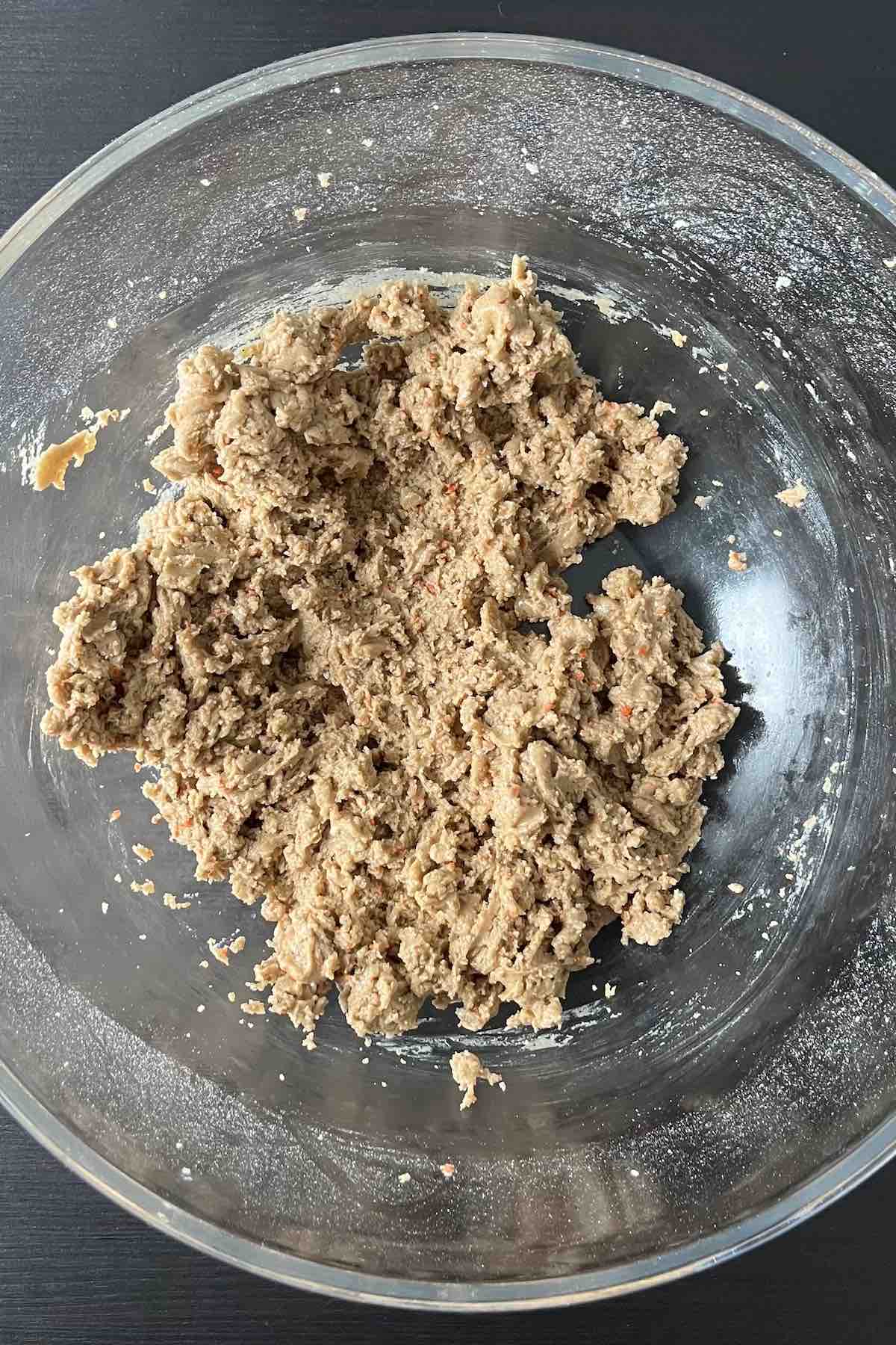 Carrot cake mix, egg and melted butter mixed together in a bowl.