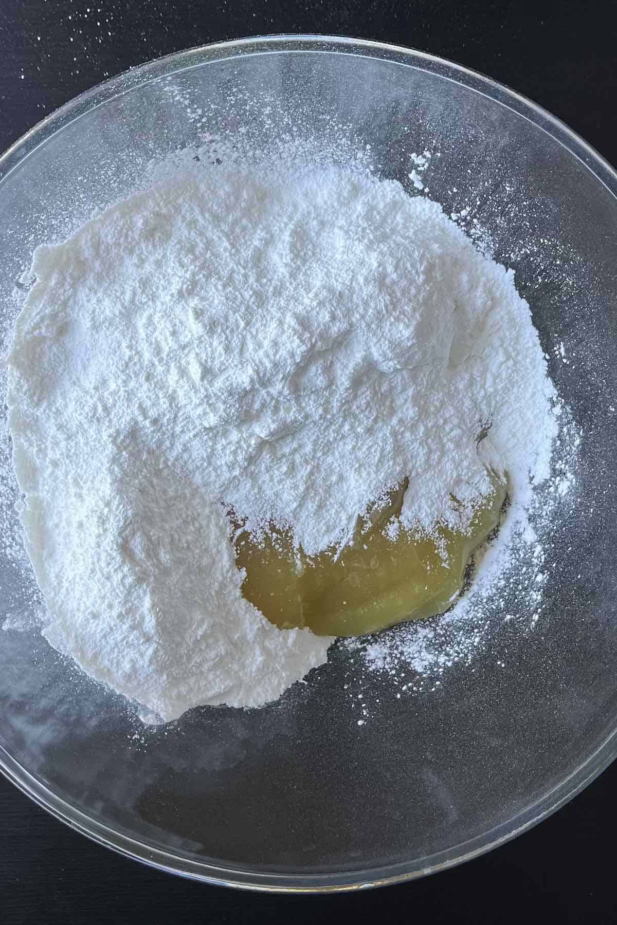 Angel food cake mix and lemon pie filling in a bowl.