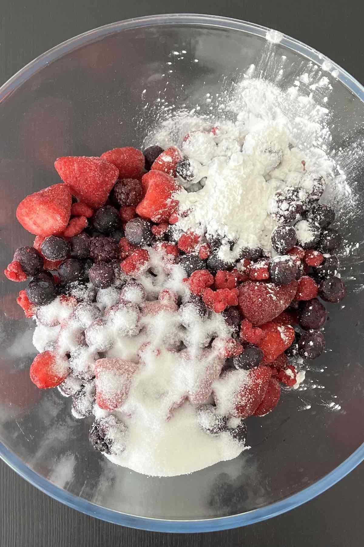 Mixed berries, sugar, cornstarch and lemon juice in a bowl