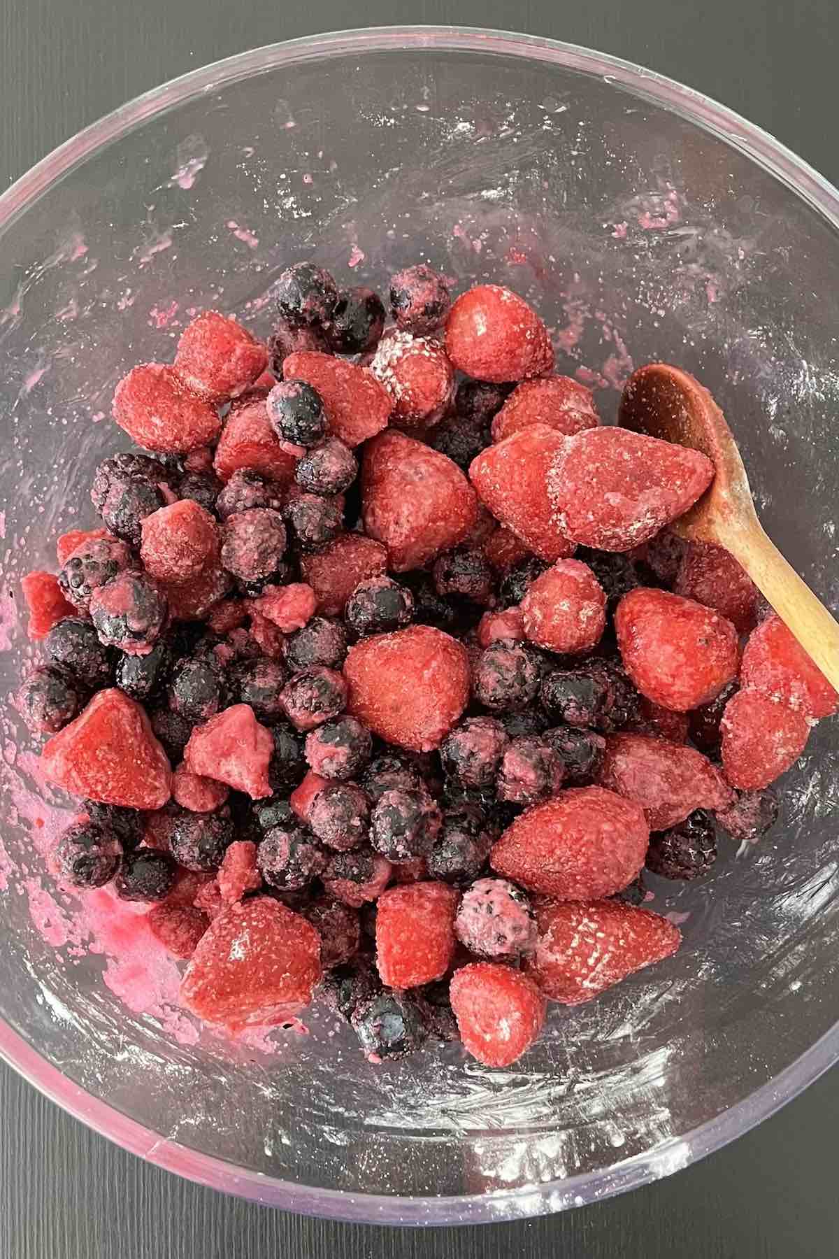 Mixed berries, sugar, cornstarch and lemon juice mixed together in a bowl