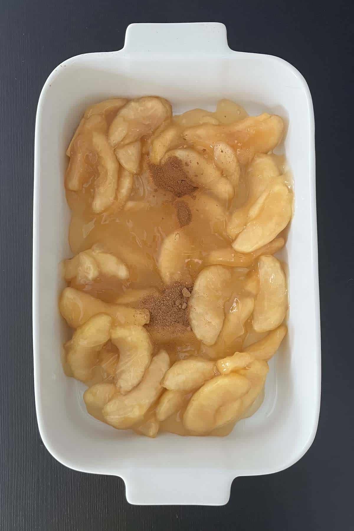 Filling ingredients in a casserole dish.