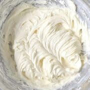 Cream cheese buttercream frosting whipped in a mixing bowl.