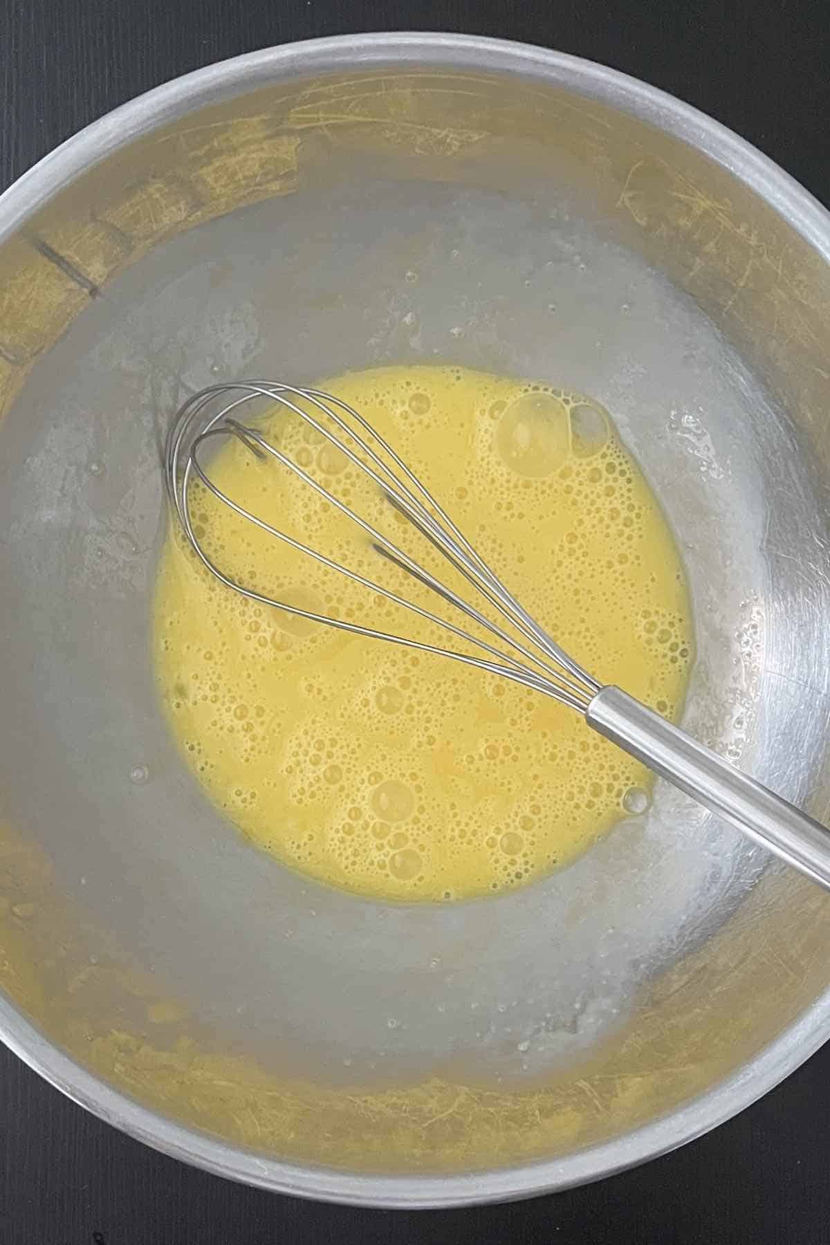 Eggs mixed in a bowl.