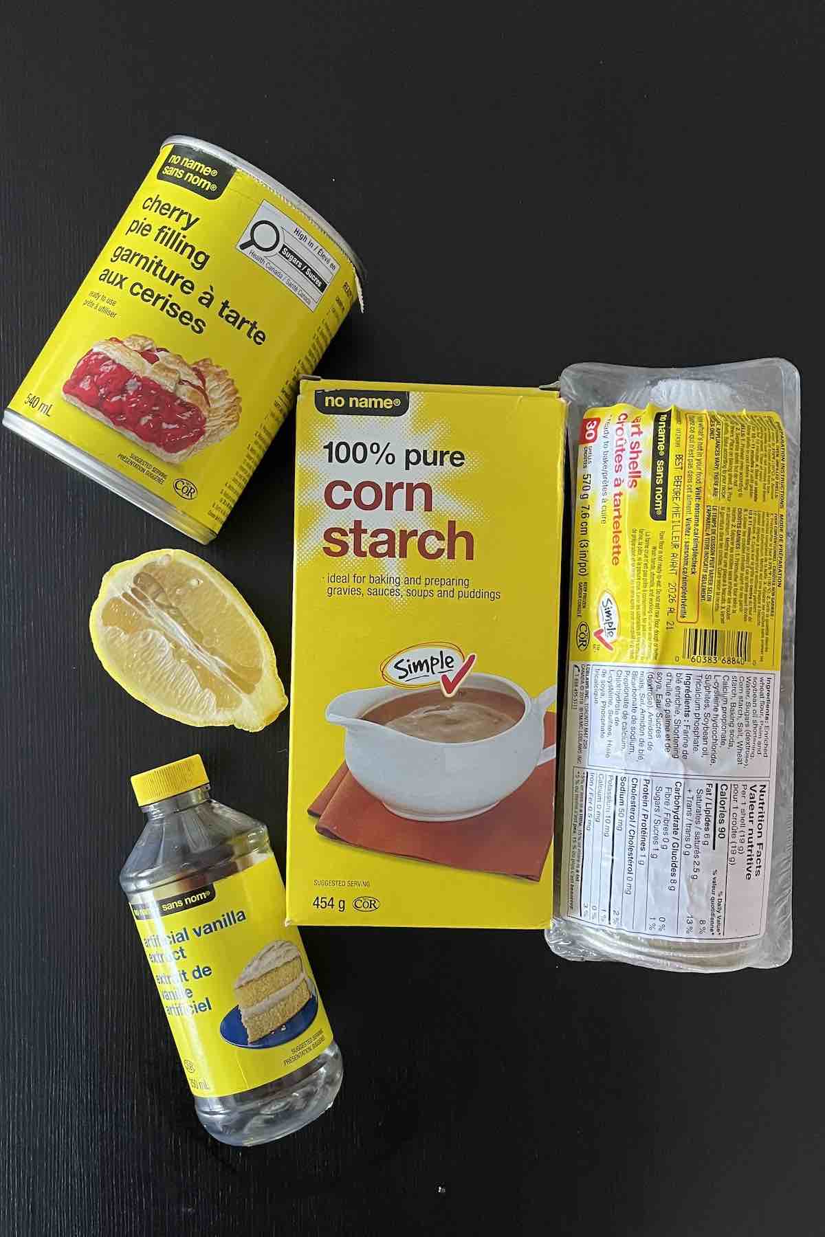 Ingredients including frozen tart shells, canned cherry pie filling, cornstarch, vanilla extract and lemon juice.