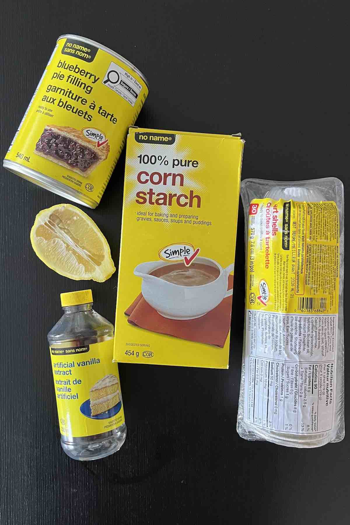 Ingredients including frozen tart shells, blueberry pie filling, cornstarch, vanilla extract, and lemon juice.