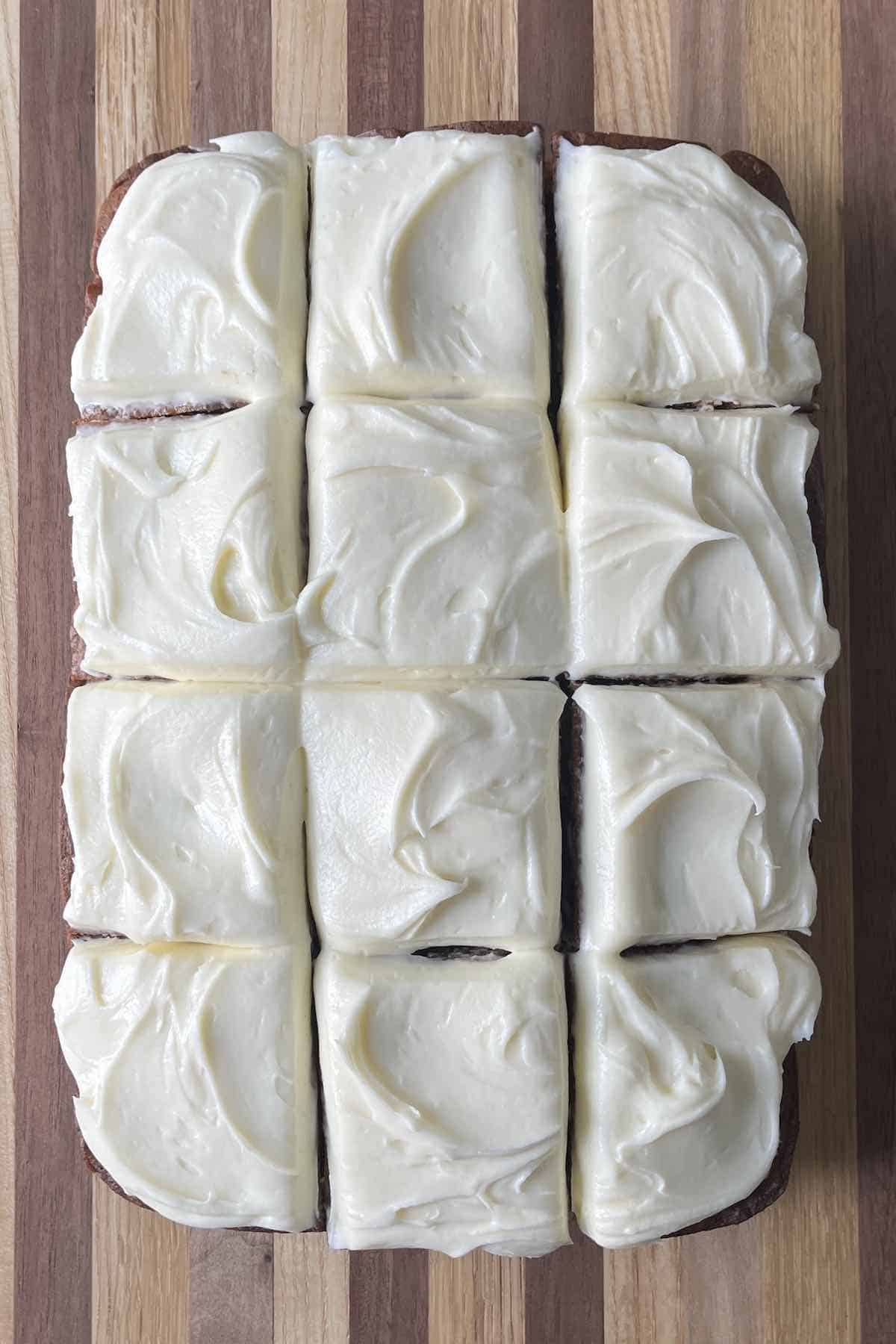 Apple spice cake sliced into 12 pieces.