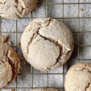 Spice cake mix cookies scattered on a cooling rack.