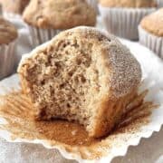Apple spice muffin with a bite taken from it.