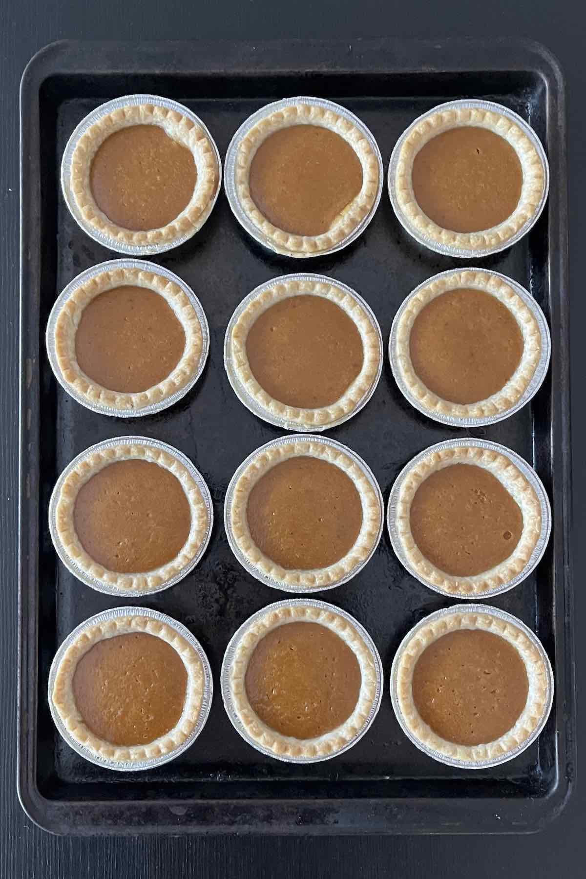 Baked pumpkin pie tarts.