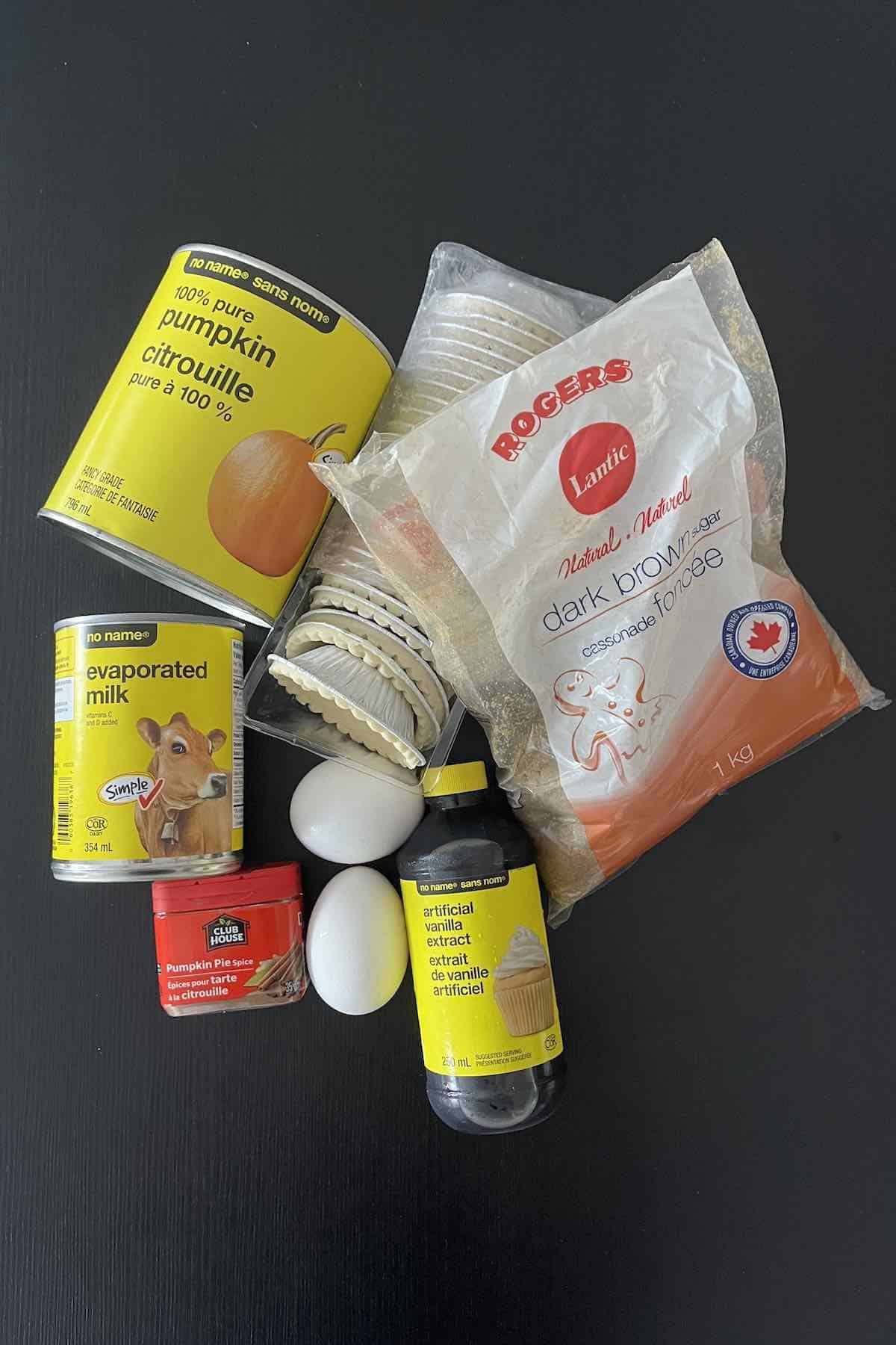 Ingredients including frozen tart shells, pumpkin puree, brown sugar, evaporated milk, eggs, vanilla, and pumpkin pie spice.