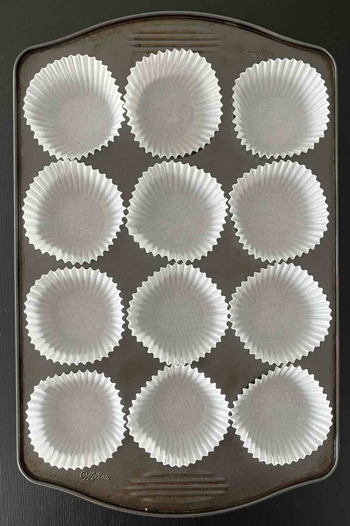 Muffin liners in muffin pan.
