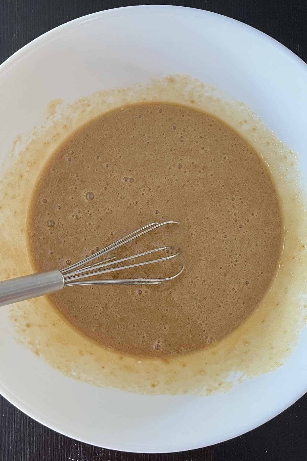 Pecan pie filling mixed in a bowl.