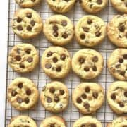 Cake mix chocolate chip cookies scattered on a cooling rack.