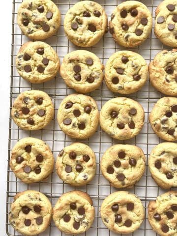 Cake mix chocolate chip cookies scattered on a cooling rack.