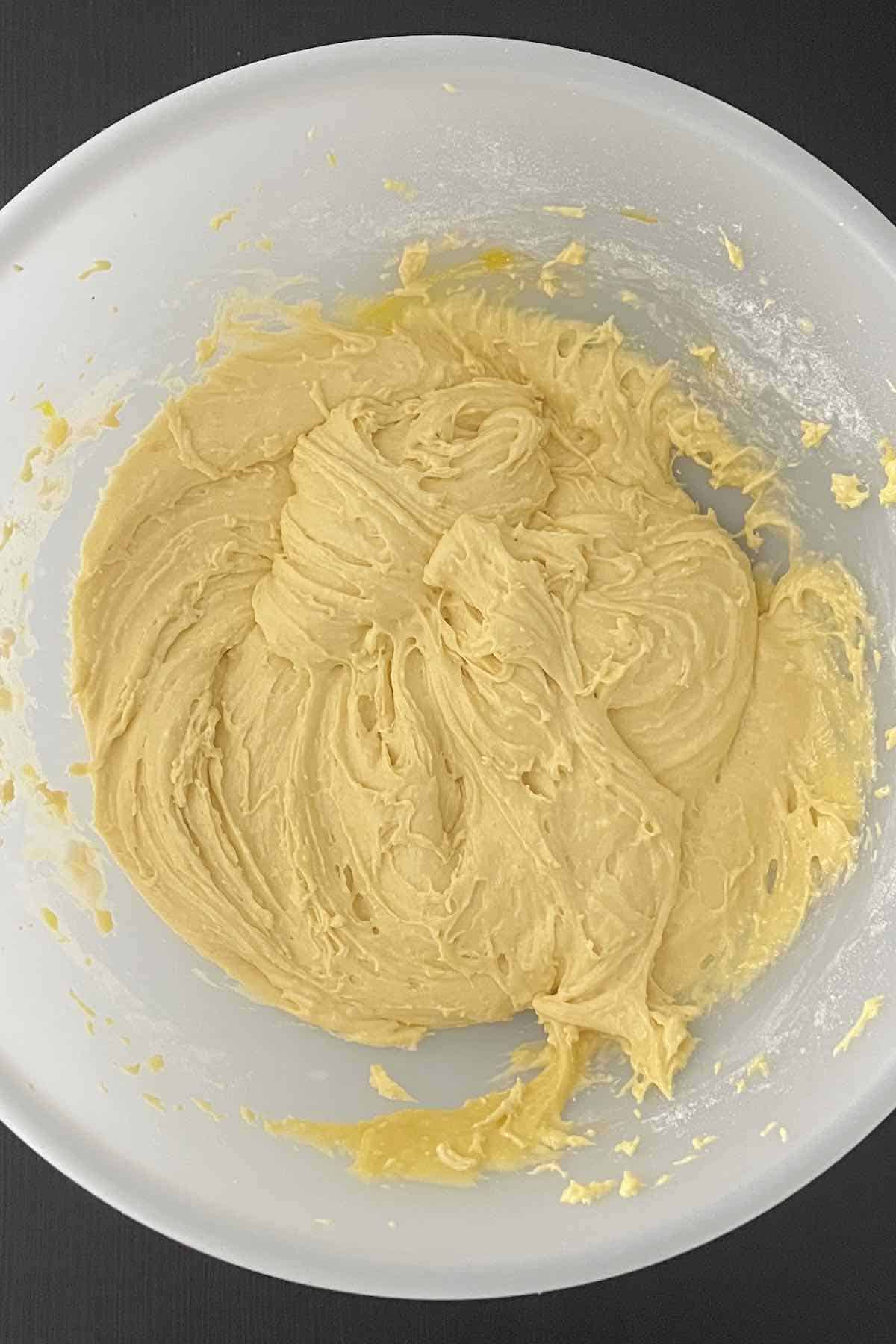 Eggs, vegetable oil, and cake mix combined in a bowl.