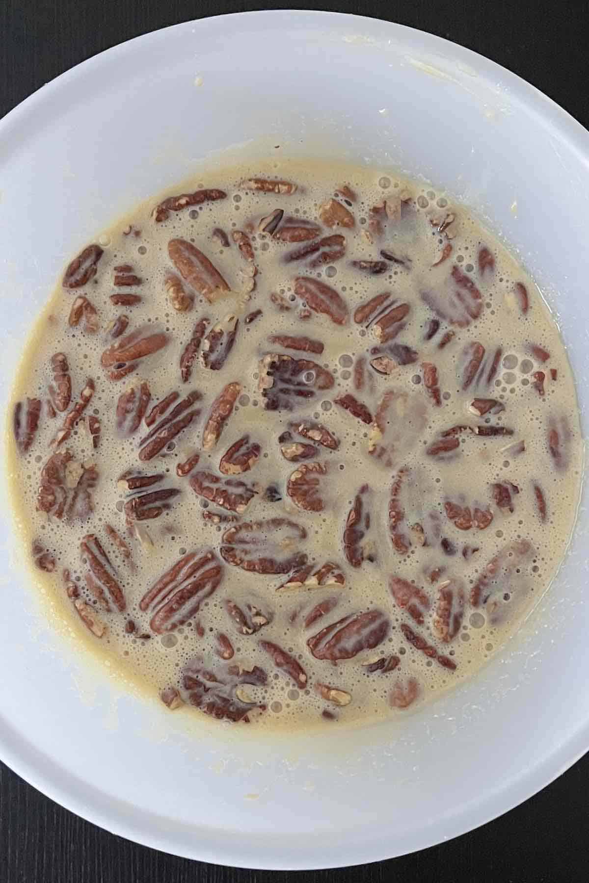 Pecans mixed into the bowl of ingredients.