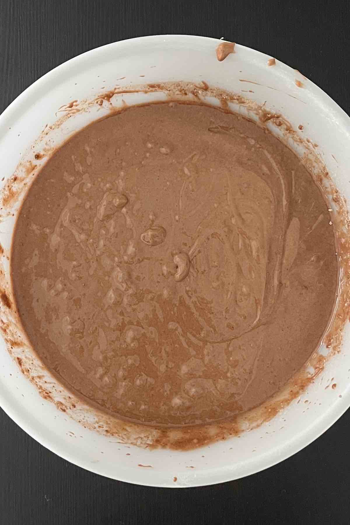 Cake batter ingredients mixed in a bowl.
