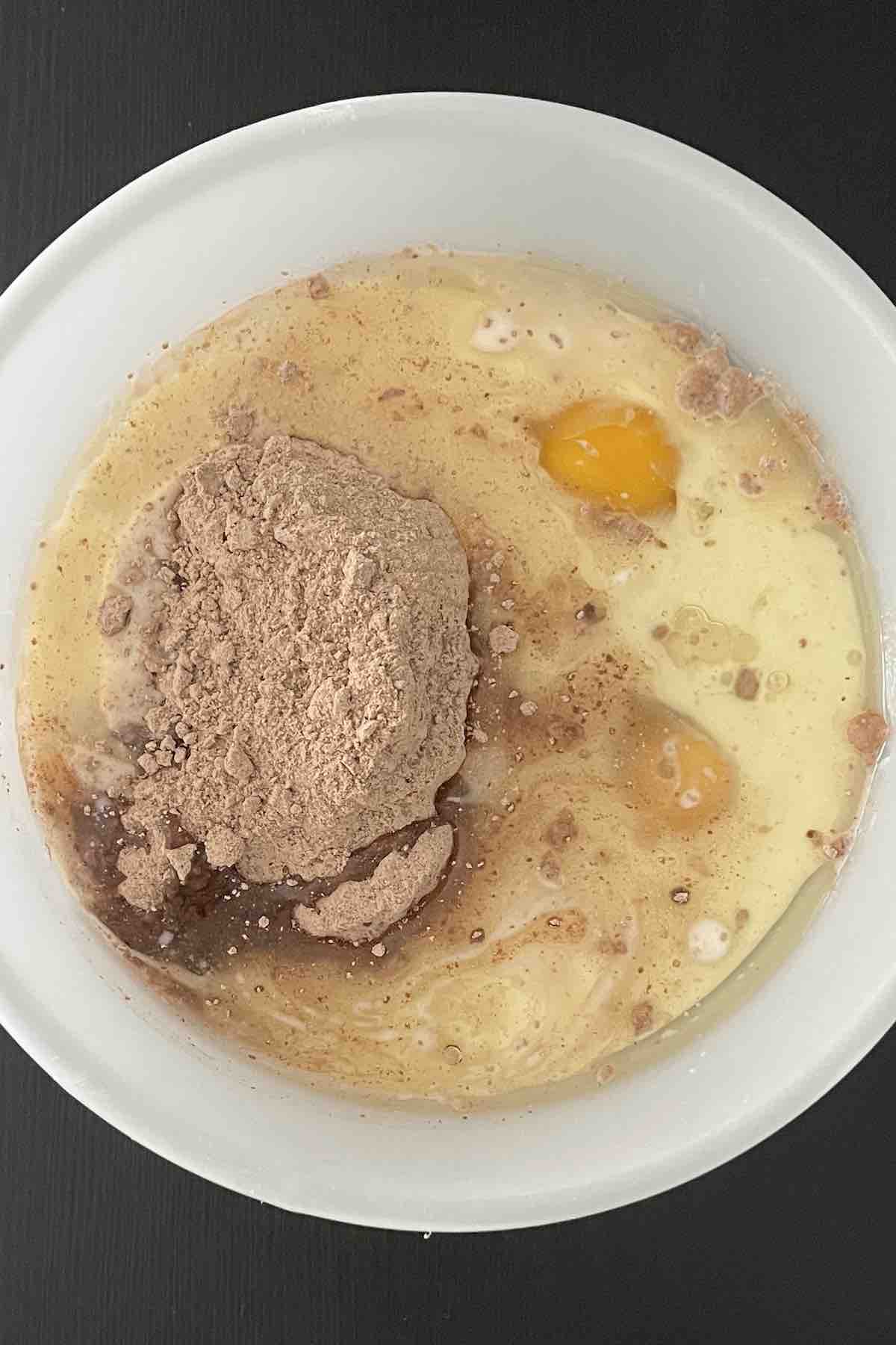 Cake batter ingredients combined in a bowl.