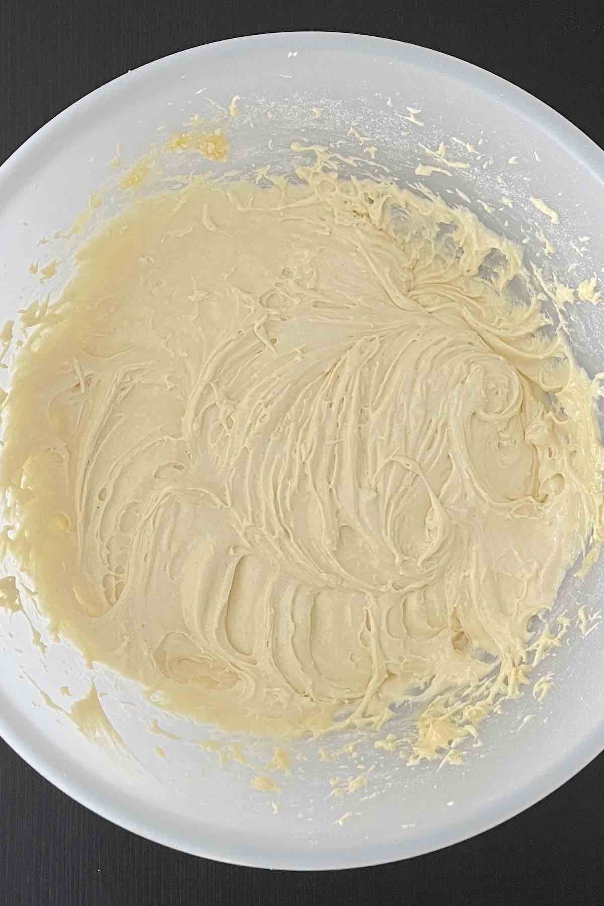 CAke mix and eggs mixed in a bowl.