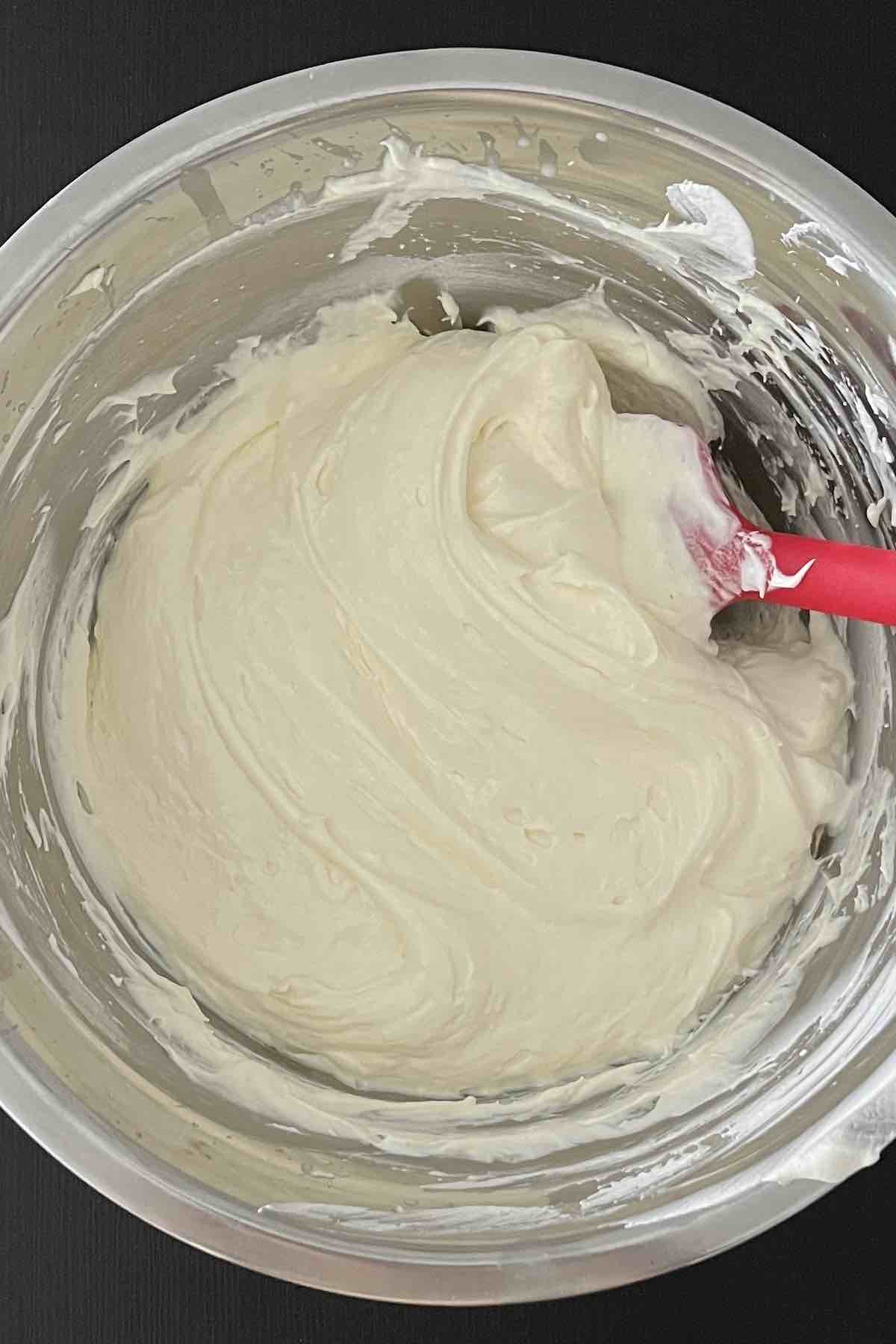 Pudding, coolwhip, and cream cheese combined in the bowl.