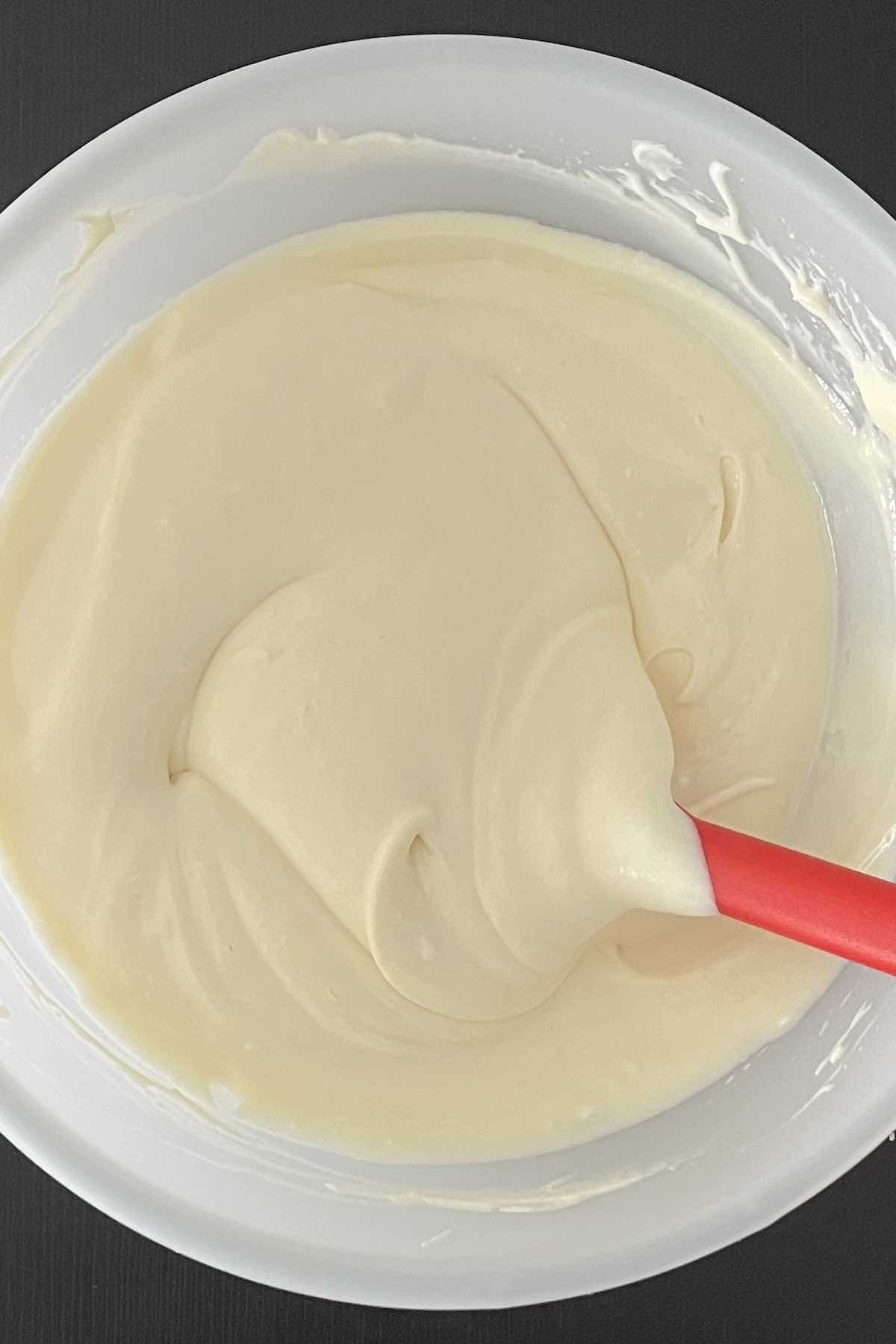 Cool Whip folded into the bowl of condensed milk and lemon juice.