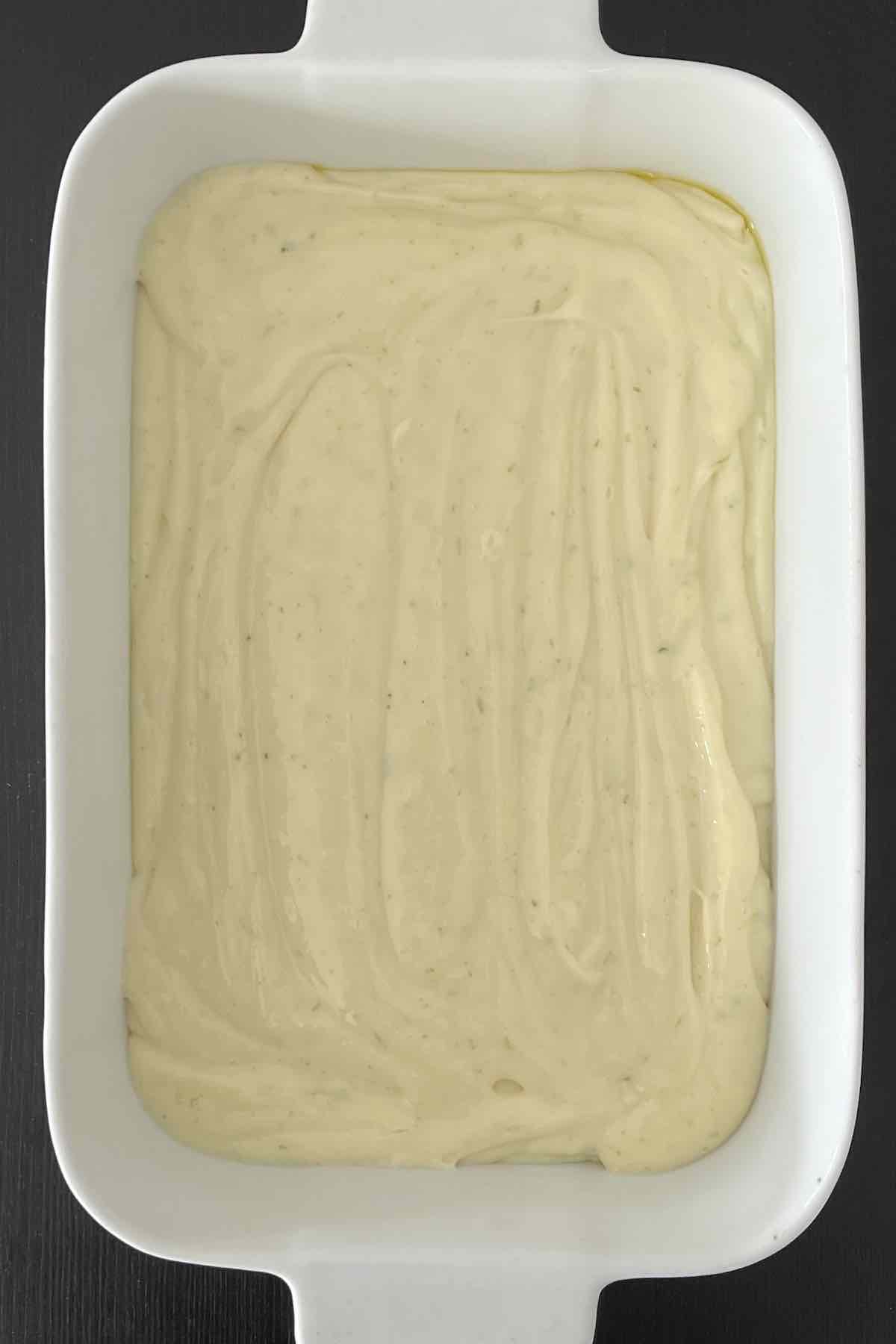Key lime filling in a white baking dish.