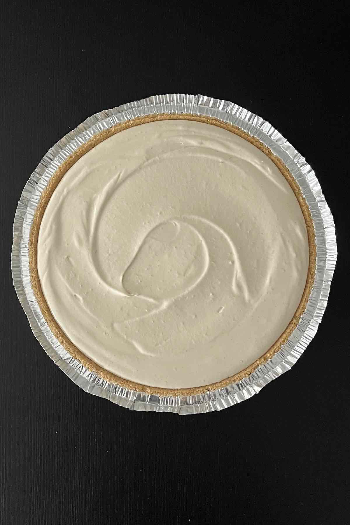 Pie filling poured into the pie crust.