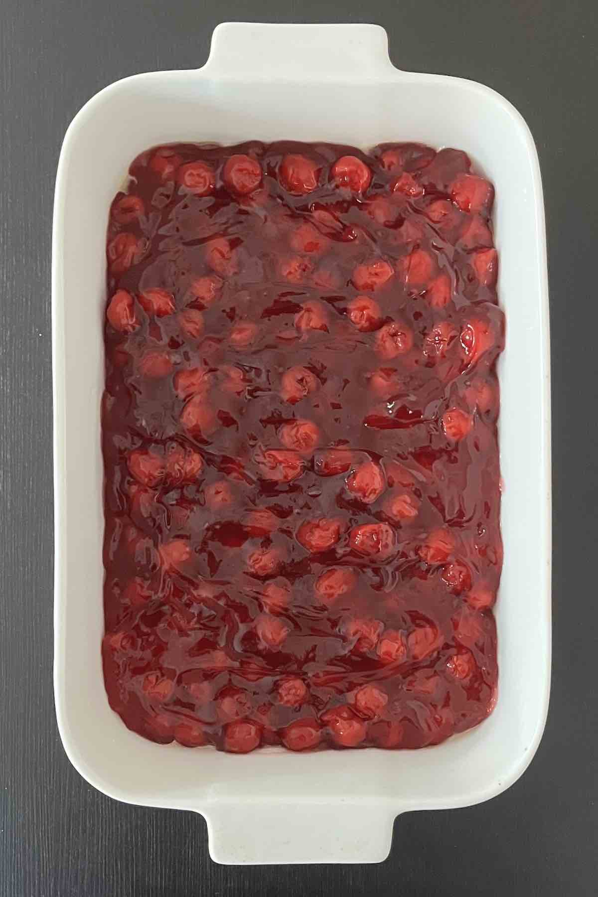 Cherry pie filling in a baking dish.