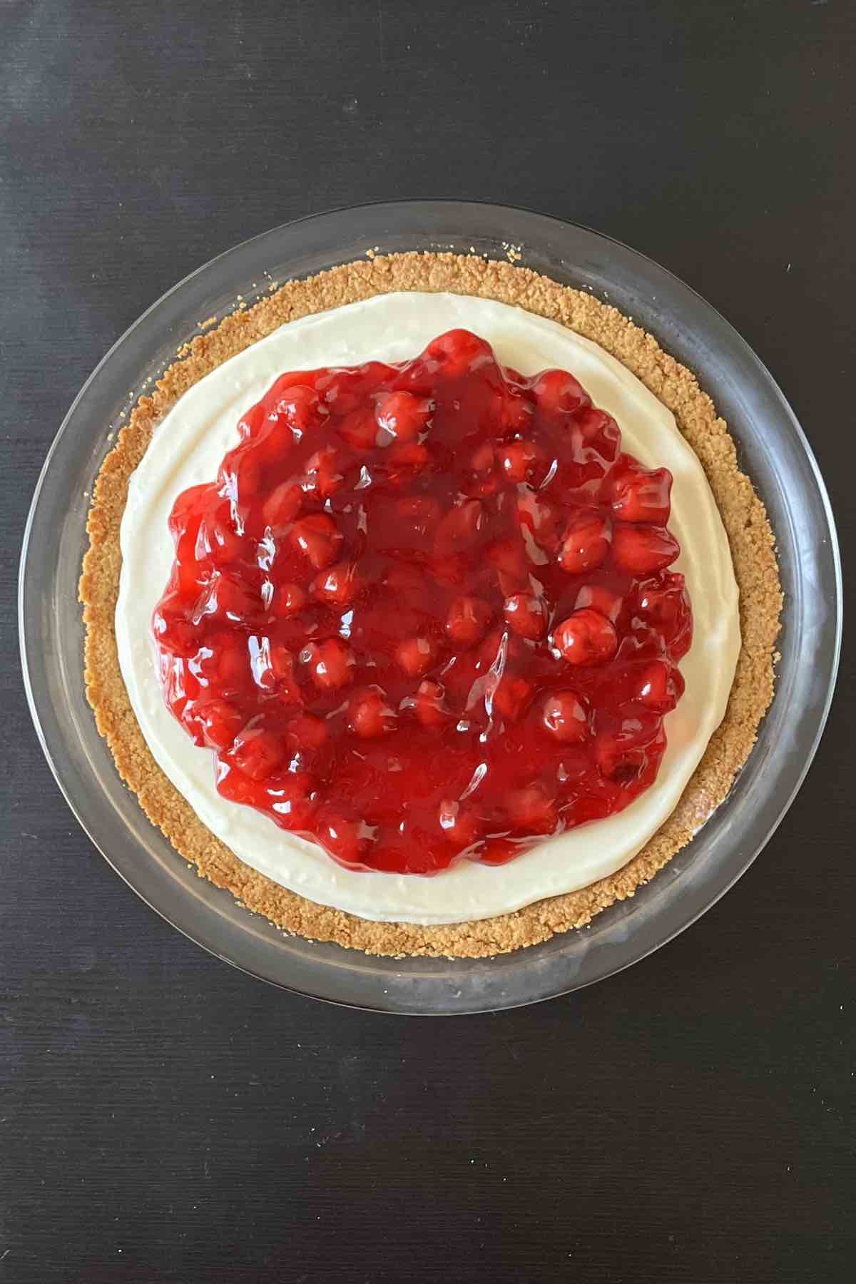 Pie filling poured into pie shell and topped with cherry pie filling.