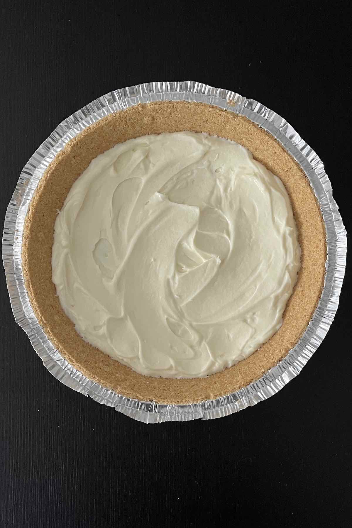 Layer of creamy pie filling in pie crust.