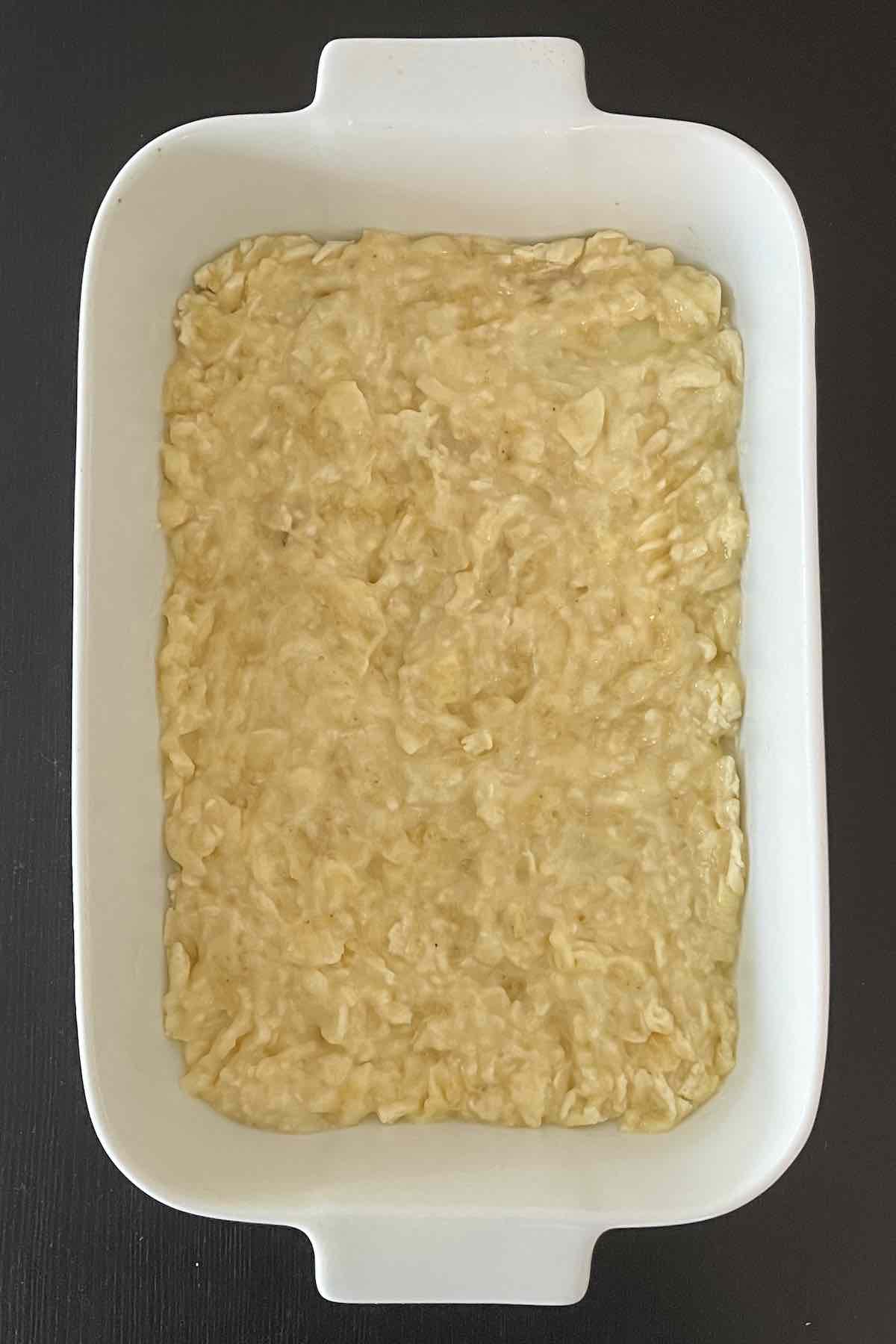 Mashed bananas in a baking dish.