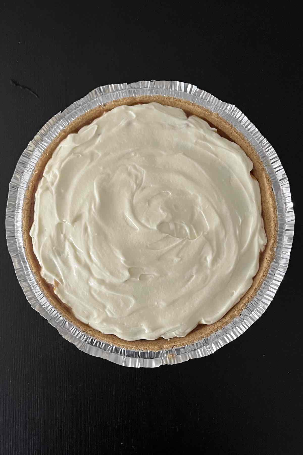 Second layer of creamy pie filling in pie crust.