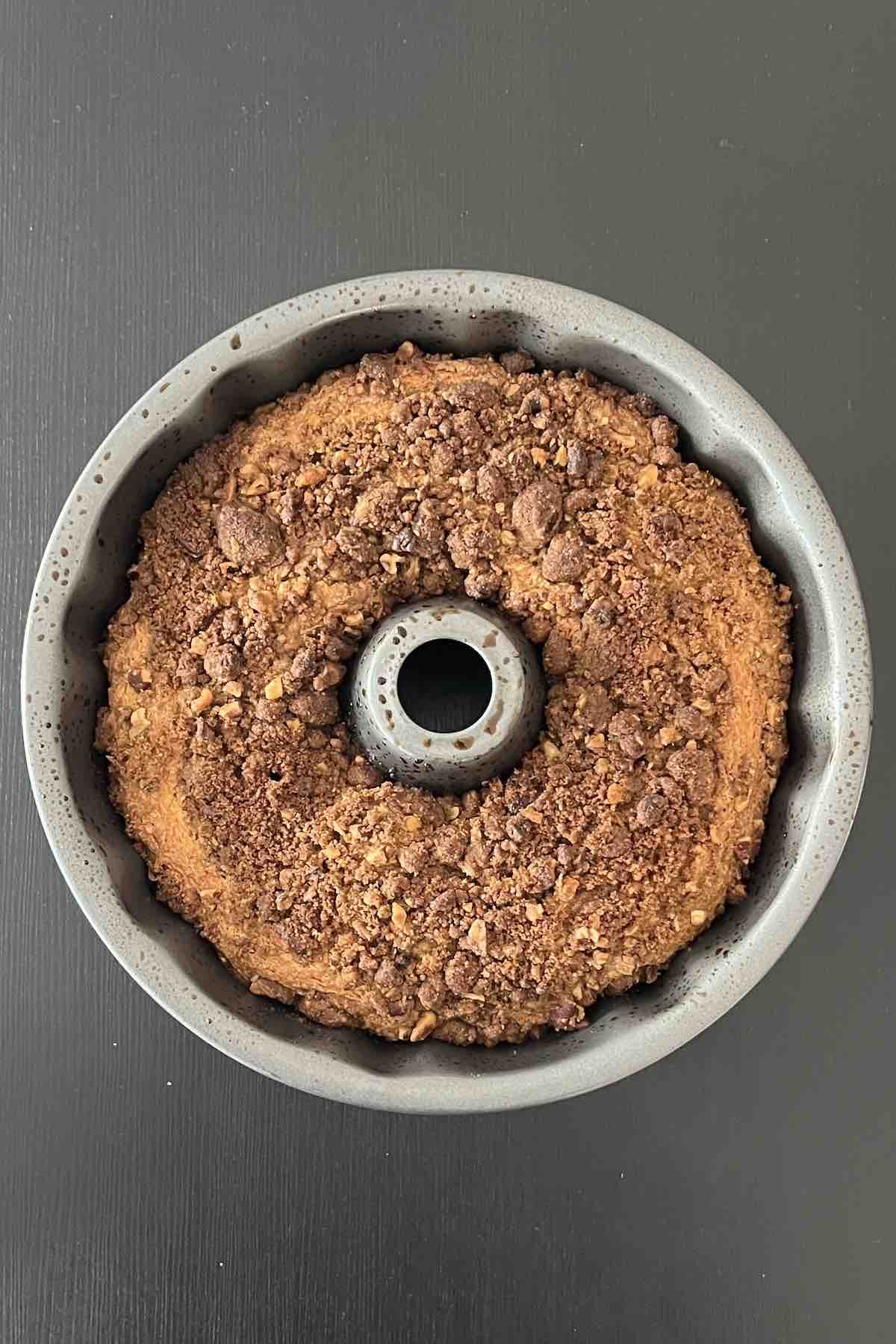 Baked coffee cake in a bundt pan.
