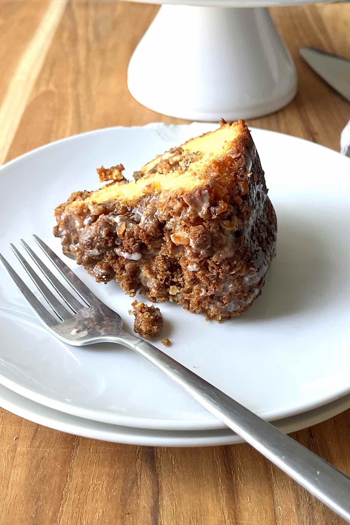Slice of coffee cake on a white plate.