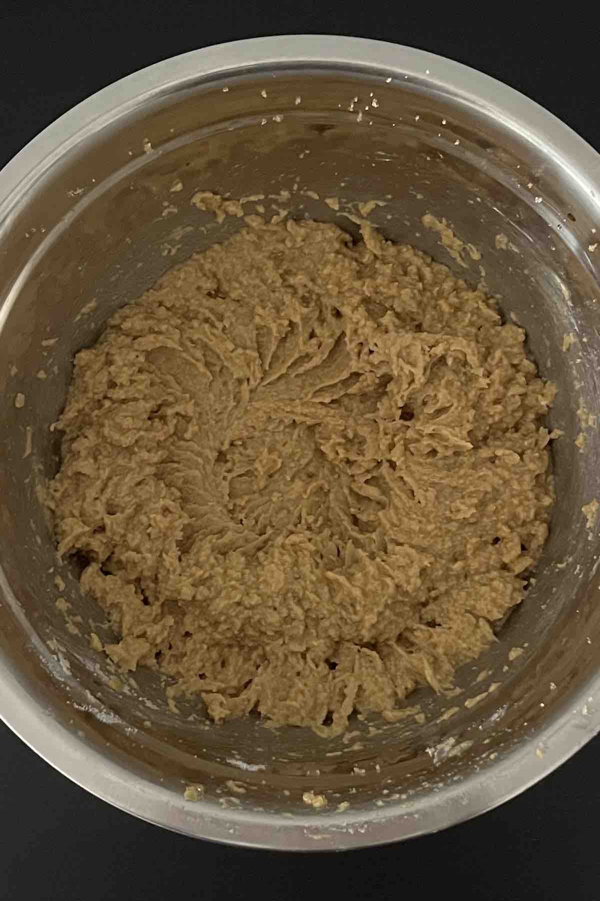 Butter, sugar, and eggs mixed in a bowl.