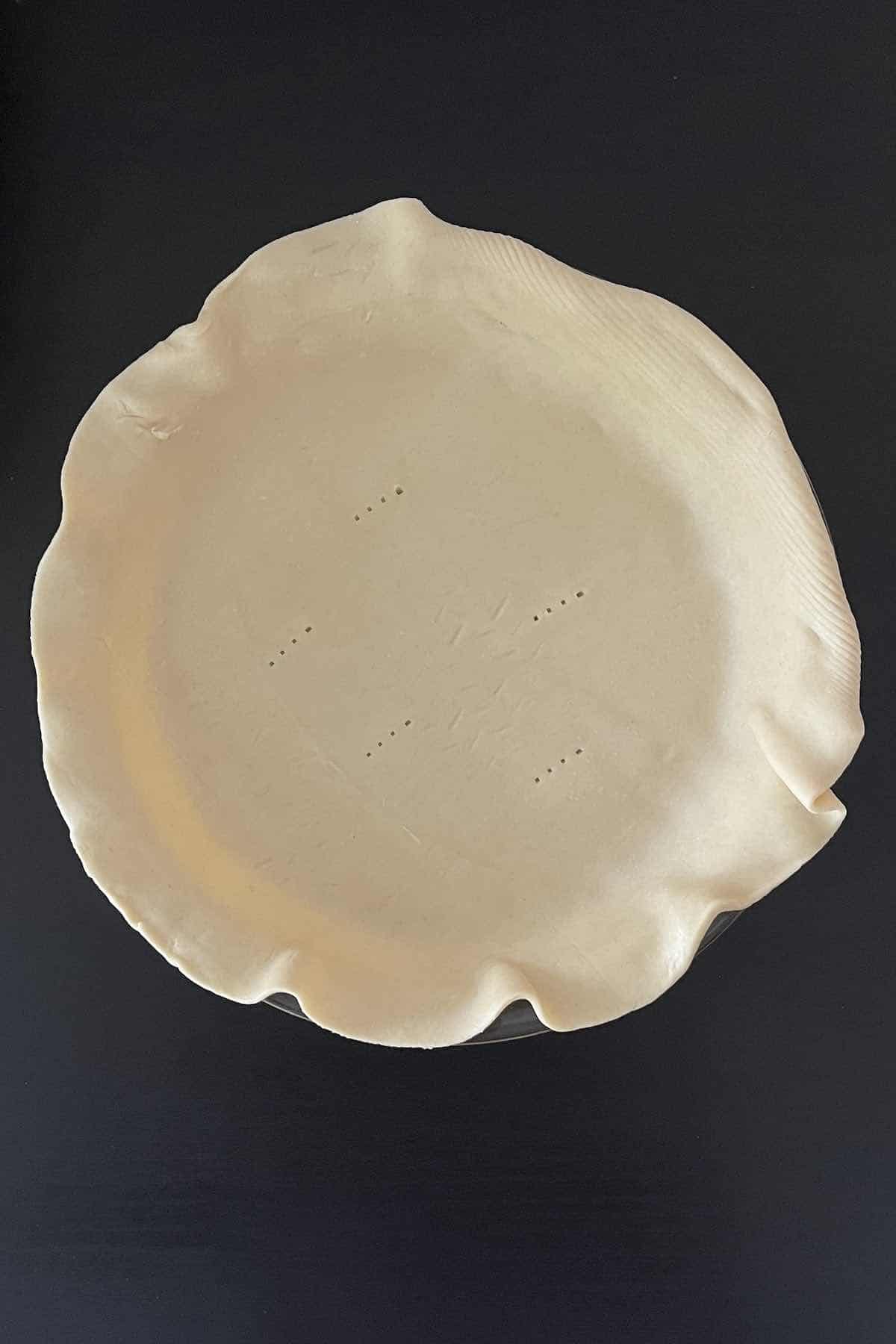 Pie sheet rolled into a pie dish.