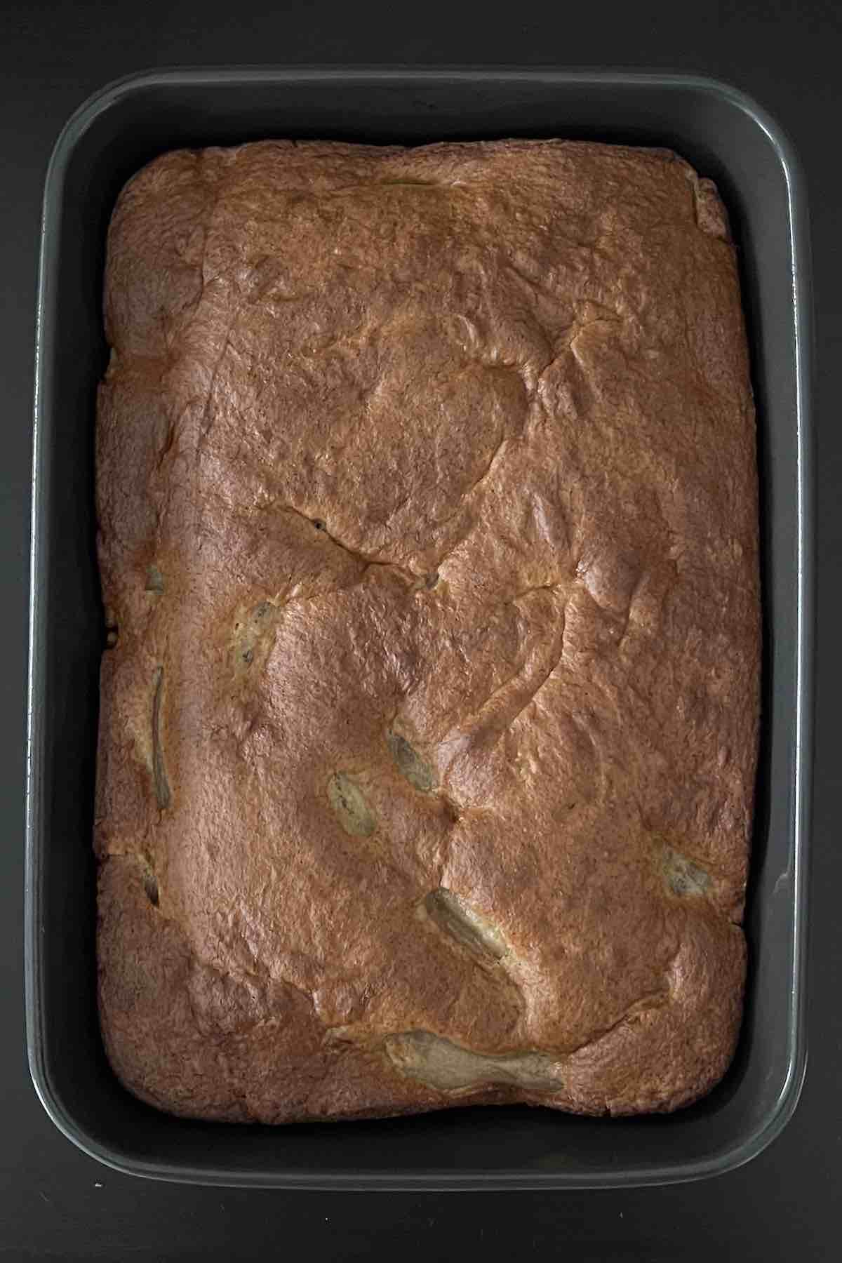 Baked apple cake in a baking dish.
