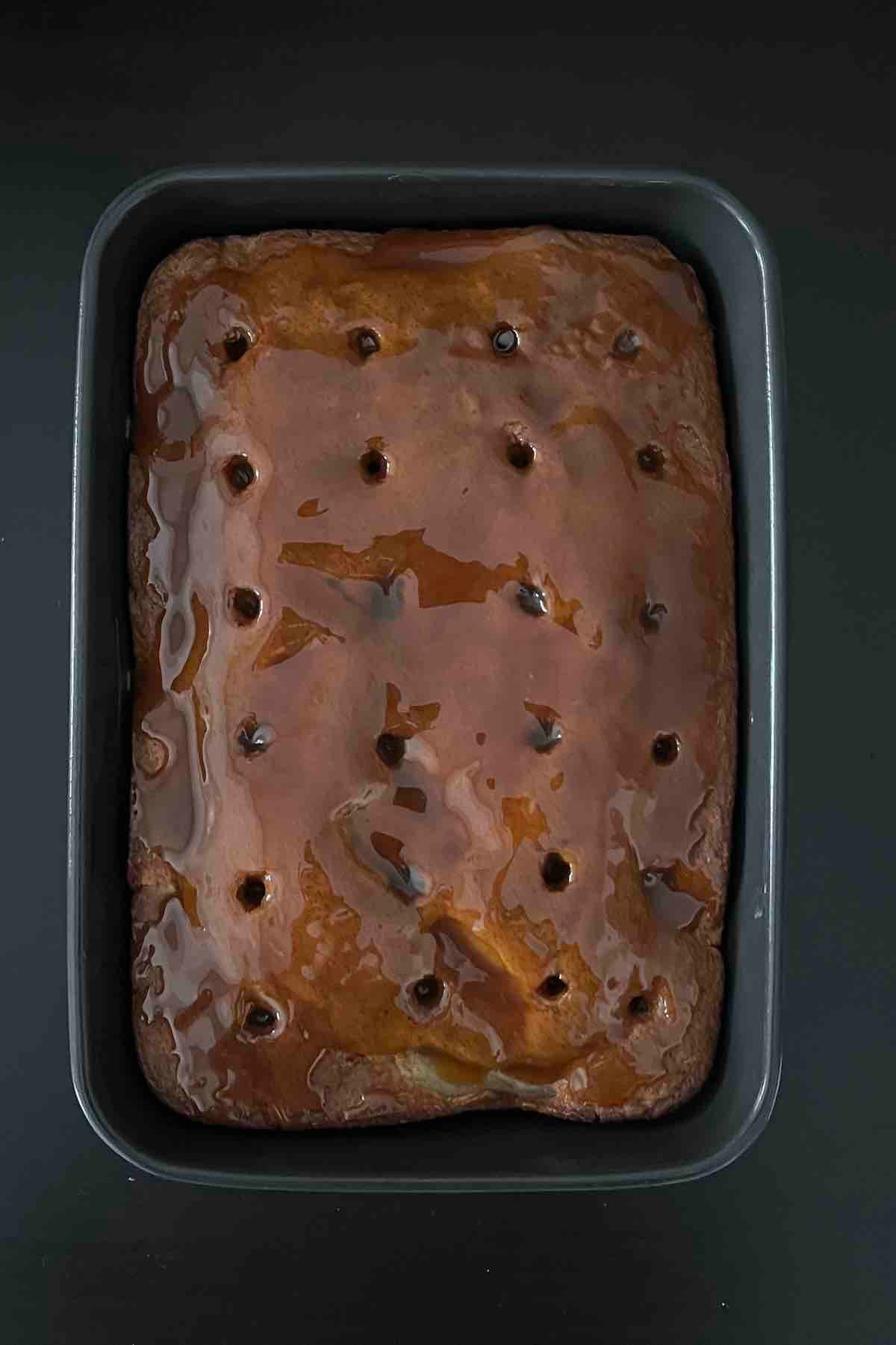 Caramel spread over the cake.